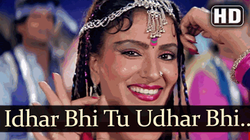 Idhar Bhi Tu Lyrics - Rekha | Satish Shah | Hema Malini | Amit Kumar | Asha Bhosle