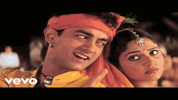 Radha Kaise Na Jale Lyrics - Aamir Khan | Gracy Singh | Paul Blackthorne | Asha Bhosle | Udit Narayan