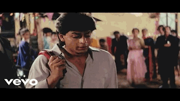 Woh To Hai Albela Lyrics - Shahrukh Khan | Naseeruddin Shah | Juhi Chawla | Devki | Kumar Sanu